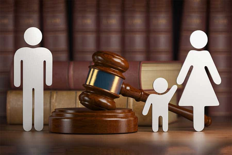 a gavel and paper cut out of people